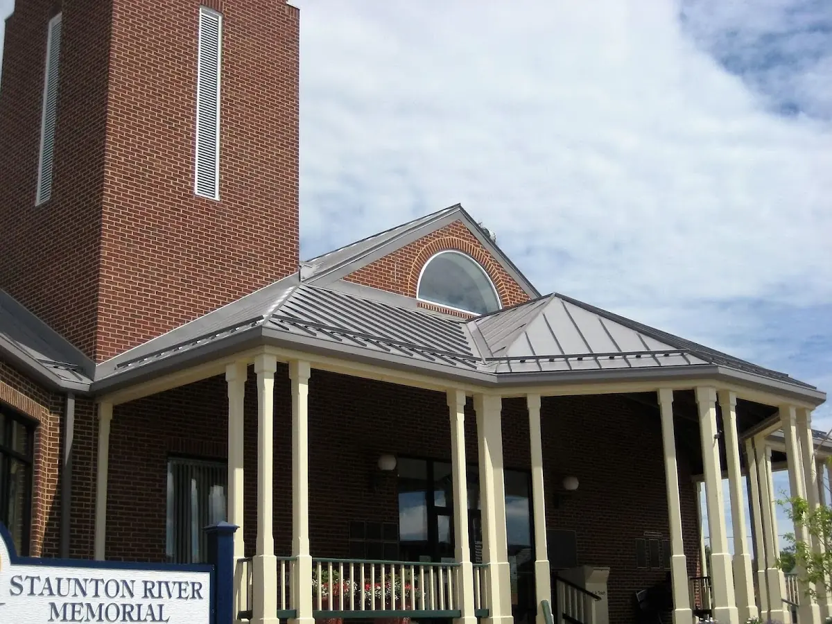 Skilled roofing craftsmen working on a residential roof in Hannibal